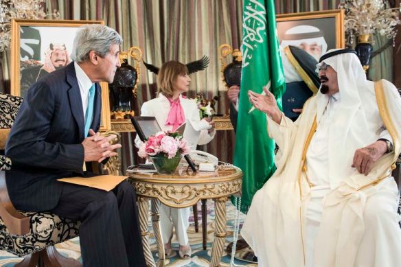Saudi King Abdullah bin Abdulaziz al-Saud and U.S. Secretary of State John Kerry wait for a meeting at the King's private residence in the Red Sea city of Jeddah