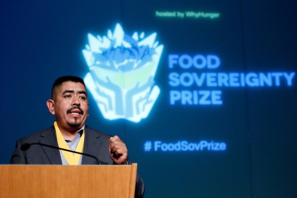 Lucas Benitez, co-director of the Coalition of Immokalee Workers from the United States, makes his acceptance speech after being honored at WhyHunger's 2012 Food Sovereignty Prize, which honors grassroots leaders working for a more democratic food system, New York, Wednesday, Oct. 10, 2012. (Stuart Ramson/Insider Images for WhyHunger)
